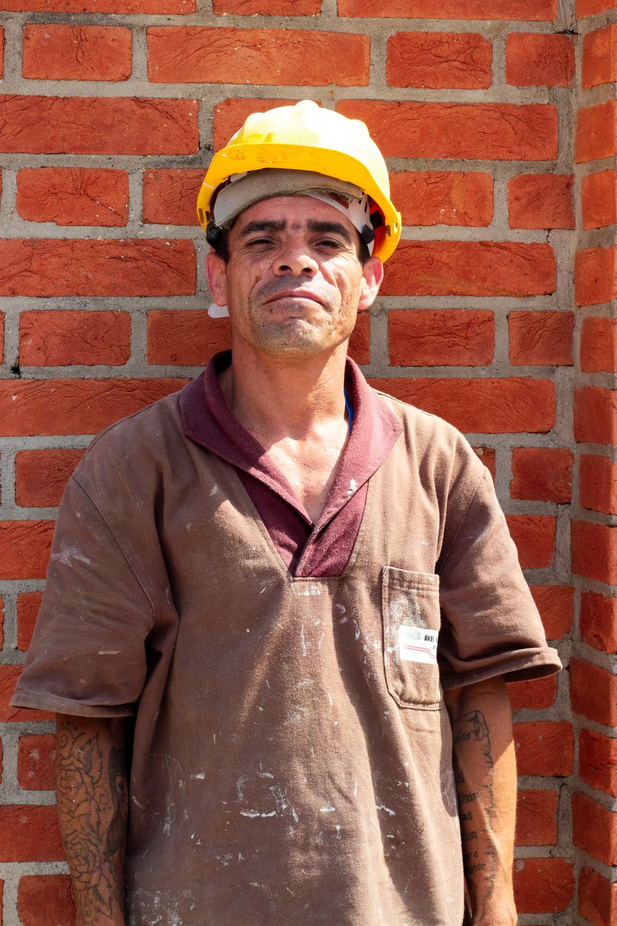 A contractor standing for a portrait on a job site